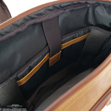 Load image into Gallery viewer, Angled interior view of the tan leather briefcase. it features a tablet and laptop pocket in the main compartment. 

