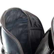 Load image into Gallery viewer, Angled interior close up to the brown leather backpack. 
