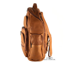 Load image into Gallery viewer, Side panel view of the tan leather backpack. It offers a zipper-closing pocket. 
