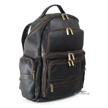 Load image into Gallery viewer, Angled front view of the brown leather backpack with multiple zipper-closing pockets. 
