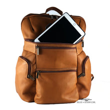 Load image into Gallery viewer, Front view of the tan leather backpack. A white tablet is peeking from the pocket. 
