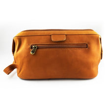 Load image into Gallery viewer, Front view of the tan leather toiletry bag. It features a zipper-closing pocket.
