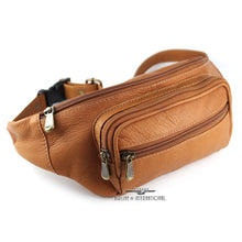 Load image into Gallery viewer, Angled front view of a tan leather waist pack with three zipper closing compartments.
