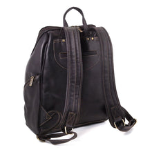 Load image into Gallery viewer, Angled back panel view of the brown leather backpack. It features a small pocket.
