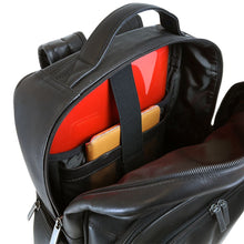 Load image into Gallery viewer, Angled interior view of the tan leather backpack. A laptop and a tablet are tucked in the dedicated compartments.

