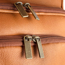 Load image into Gallery viewer, Close up to the front panel pockets brass zipper pulls.
