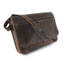 Load image into Gallery viewer, Angled front view of the brown leather messenger bag. The matching adjustable strap is resting across the front.
