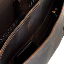 Load image into Gallery viewer, Angled interior view of the messenger bag. A laptop, phone, and two pens are organized in their compartments. 
