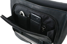 Load image into Gallery viewer, Interior view of the opened front pocket. A cellphone, USB cable, and pen are tucked in the dedicated compartments.
