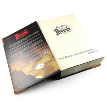 Load image into Gallery viewer, Angled view of the book-shaped box. The cover is opened revealing an introduction to the pen, and the Dracula design with a quote at the bottom: &quot;I am Dracula, and I bid you welcome...&quot; Chapter 02.
