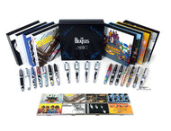 View of the included boxes with the pens and card cases arranged in front of them. Set on a white background.