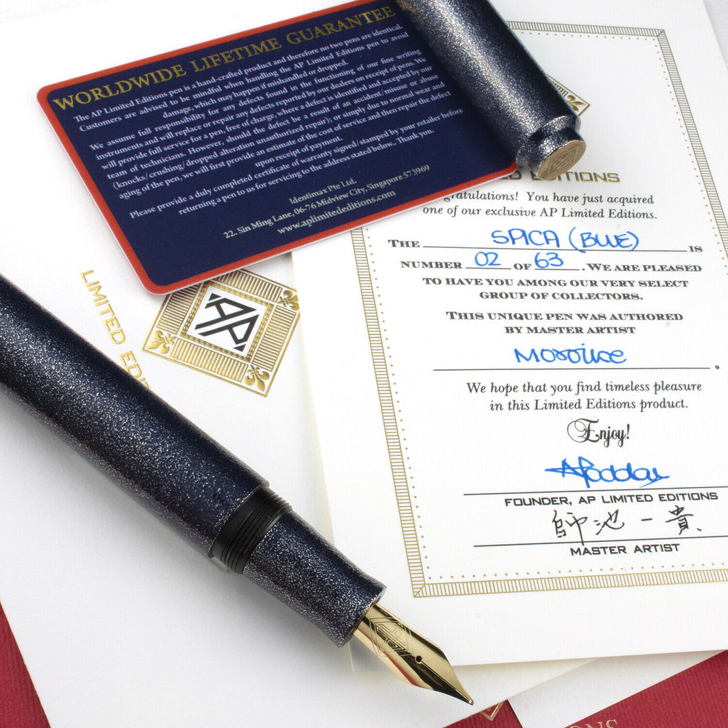 Arrangement of the Fountain Pen with the cap set aside on top of the included certificates. 