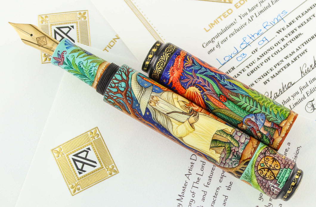 Front view of the fountain pen with the cap set to the side. The pen is set on top of the signed certificates included. 
