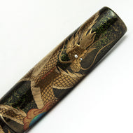 Cap Close-Up. Set on a white background. A golden dragon is depicted.