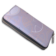 Angled view of the wallet. It is a lavender with some white and pink outlines. The zipper is black, and the slider has the ACME logo on it. Set on a white background.
