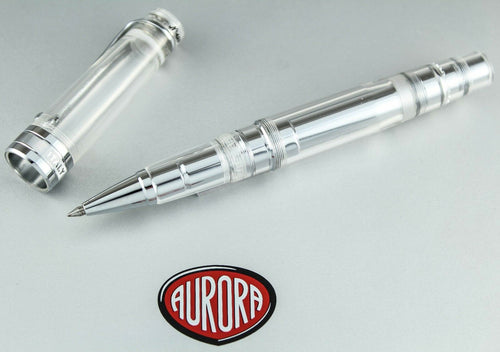 Arrangement of the rollerball pen with the cap placed next to it. Placed on top of the presentation box. 