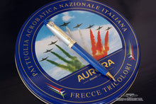 Load image into Gallery viewer, Front view of the blue and white pen on top of the presentation tin lid.

