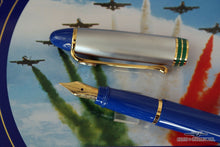 Load image into Gallery viewer, Close up to the fountain pen nib of the blue and green fountain pen. Placed on top of the presentation tin.
