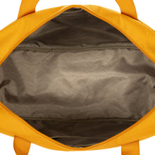 Load image into Gallery viewer, Top view of the duffle bag with the main compartment opened. 
