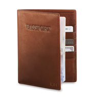 Angled front panel view of the tan leather passport cover. 