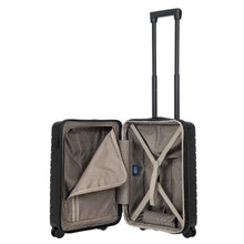 Load image into Gallery viewer, Interior view of the black hard shell suitcase. The fabric lining is light brown. The front panel&#39;s side has a zipper-closing compartment. The back panel&#39;s side has a set of straps to hold contents in place. 

