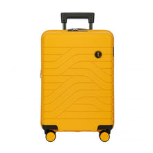 Load image into Gallery viewer, Front view of the mango yellow hard shell suitcase with black accents. The panel has a textured wave lines design, and a small black circular logo at the top right. The telescopic handle is pulled up.
