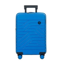 Load image into Gallery viewer, Front view of the electric blue hard shell suitcase with black accents. The panel has a textured wave lines design, and a small black circular logo at the top right. The telescopic handle is partly pulled.

