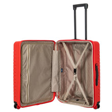 Load image into Gallery viewer, Internal view of the red hard shell suitcase with black accents. The fabric lining is light brown. The front panel&#39;s side has a zipper-closing compartment. The back panel&#39;s side has a set of strips to hold contents in place. 
