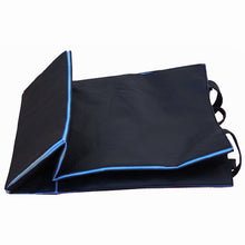 Load image into Gallery viewer, The black tote bag flattened. 

