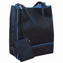 Load image into Gallery viewer, Angled front view of the tote bag with the detachable change bag. 
