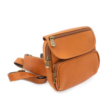 Load image into Gallery viewer, Angled front view of the tan leather hip pack. 
