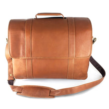 Load image into Gallery viewer, Front view of the tan leather briefcase. The shoulder strap is set in front of it.
