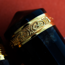 Load image into Gallery viewer, Close up to the golden cap band on the cap, engraved with decorations.
