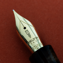 Load image into Gallery viewer, Close up to the fountain pen nib with engraved Delt Italy logo, 18-750, M
