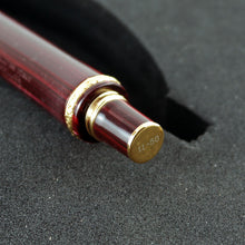 Load image into Gallery viewer, Angled close up to the red pen's bottom section. 11-50 is engraved at the center.
