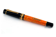 Load image into Gallery viewer, Angled view of the fountain pen with the cap on.

