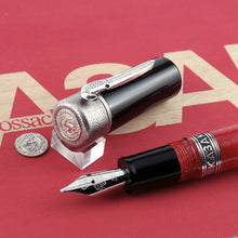 Load image into Gallery viewer, Close up to the fountain pen nib with the cap and coin placed behind it. 
