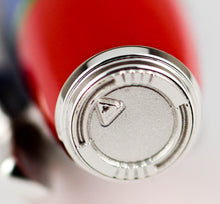 Load image into Gallery viewer, Close sup to the pen's silver disk with engraved decorations.
