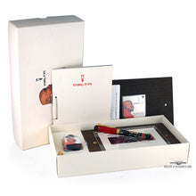Load image into Gallery viewer, The fountain pen arranged with the presentation box, booklets, ink box, and certificates on a white background. 
