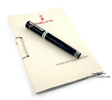 Load image into Gallery viewer, angled view of the fountain pen laid on top of the included booklet.
