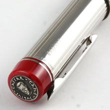 Load image into Gallery viewer, Angled view of the top of the pen. A silver coin with Julius Caesar face and name is at the top. 
