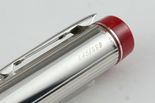 Load image into Gallery viewer, Angled close up to the top of the cap. it has the edition number 545/999 and silver hallmarks engraved. 

