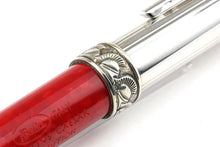 Load image into Gallery viewer, Angled close up to the decorated cap on the silver portion of the pen. it has roman soldier helmets engraved in it.
