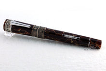 Load image into Gallery viewer, Angled front view of the fountain pen with the cap on.
