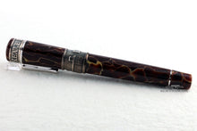 Load image into Gallery viewer, Angled back view of the fountain pen with the cap on

