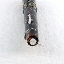 Load image into Gallery viewer, Angled close up to the bottom of the pen barrel. The edition number 319-750 is engraved on a silver disk.
