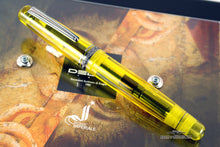 Load image into Gallery viewer, Front view of the fountain pen with the cap on. Set on top of the presentation box.
