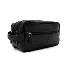 Load image into Gallery viewer, Angled front view of the black leather toiletry bag.
