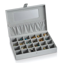 Load image into Gallery viewer, Interior view of the earring case with different pairs arranged in the compartments. 
