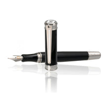 Load image into Gallery viewer, Angled view of the fountain pen with the cap in front of it. 
